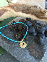 Load image into Gallery viewer, Turquoise bead bracelet with14 karat yelliw gold cross disc charm